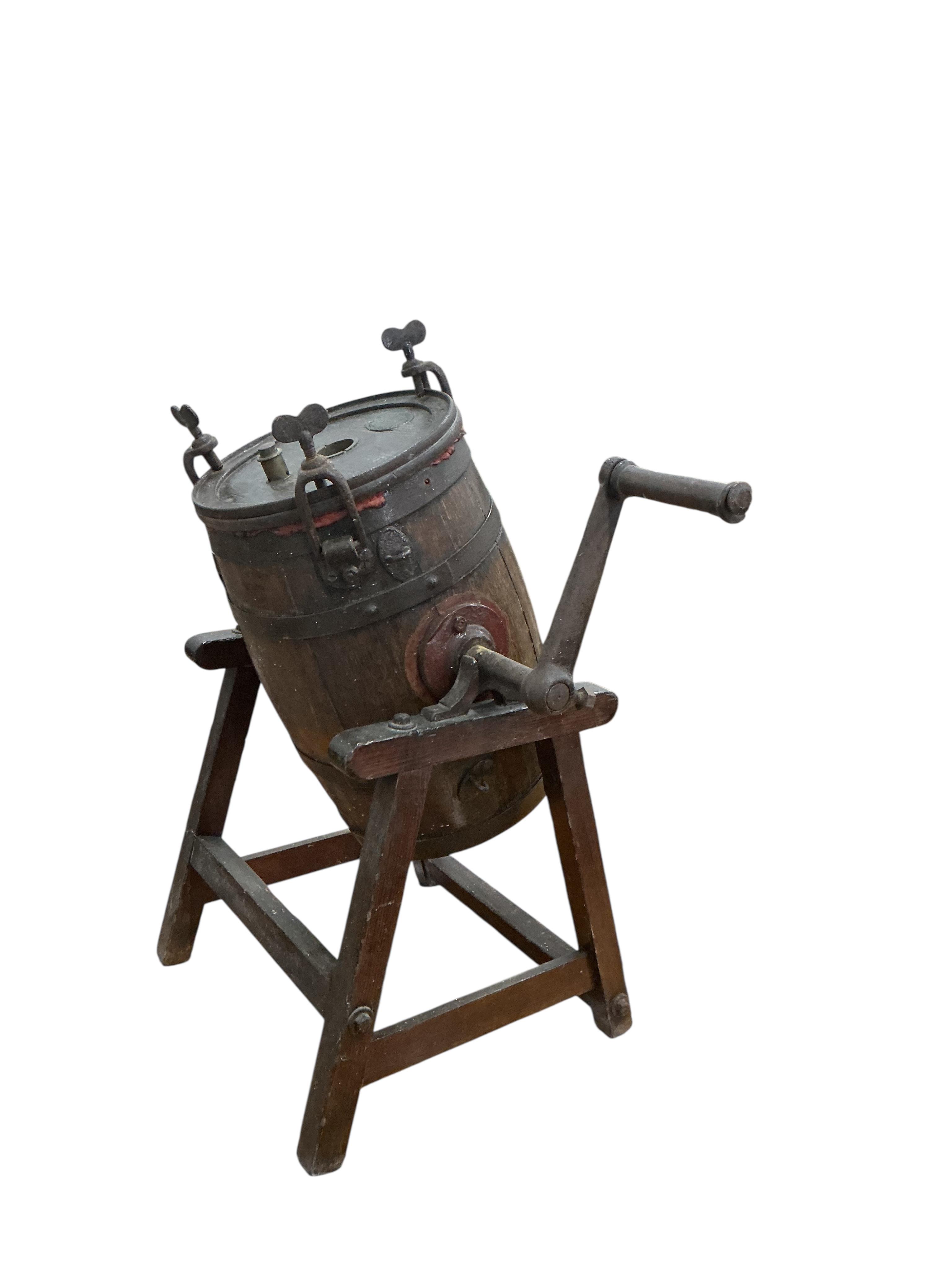 A Victorian Waide & Sons iron bound staved oak butter churn on stand